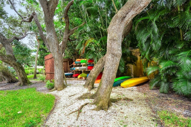 view of home's community with fence