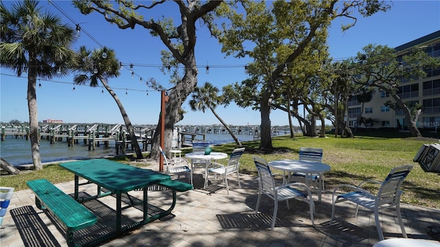 view of patio / terrace featuring outdoor dining area and a water view