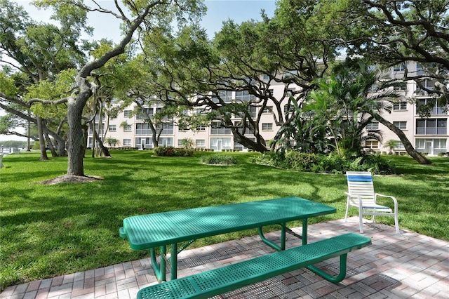 surrounding community with a yard