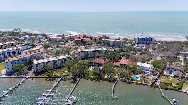 birds eye view of property featuring a water view and a view of city