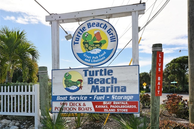 community sign with fence