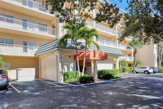 view of property featuring uncovered parking
