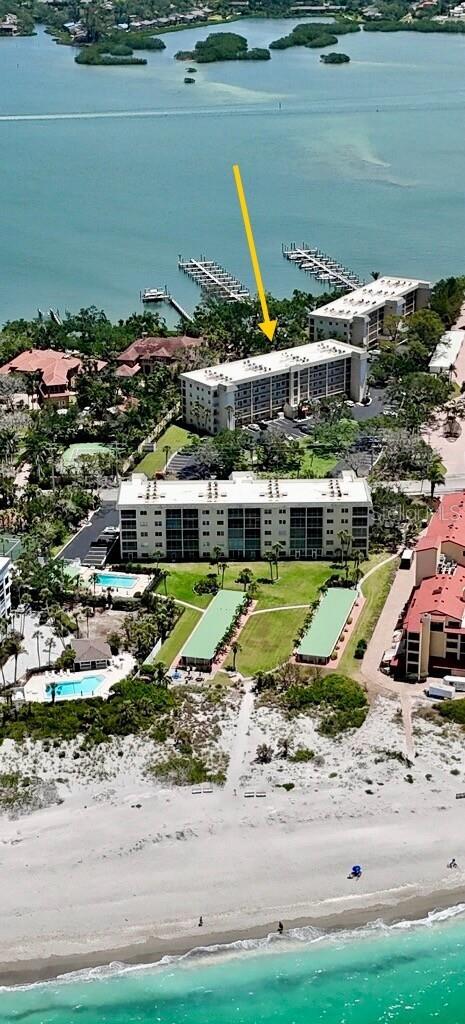 8625 Midnight Pass Rd Unit 305B, Siesta Key, FL 34242 - bird's eye view of expansive beach
