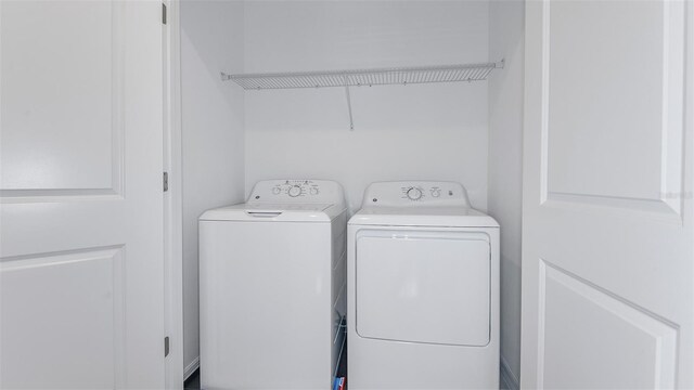 laundry area with washer and clothes dryer and laundry area