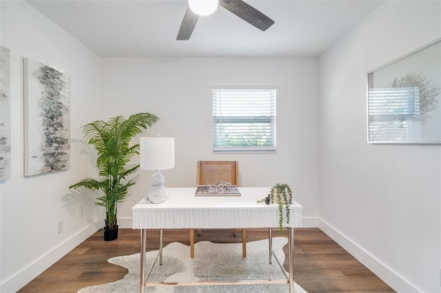 home office featuring wood finished floors, baseboards, and ceiling fan