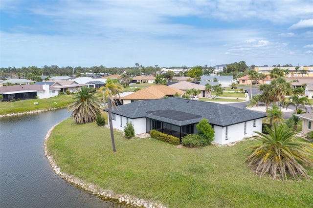 bird's eye view with a residential view and a water view