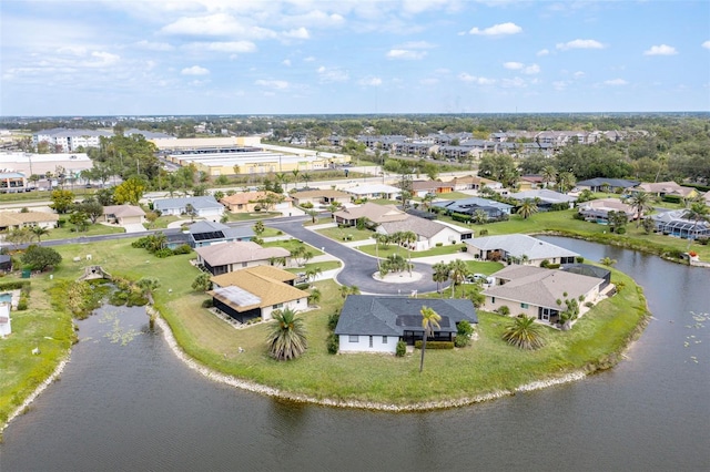 drone / aerial view with a residential view and a water view