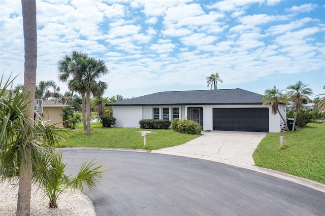 ranch-style house featuring driveway, an attached garage, a shingled roof, stucco siding, and a front lawn