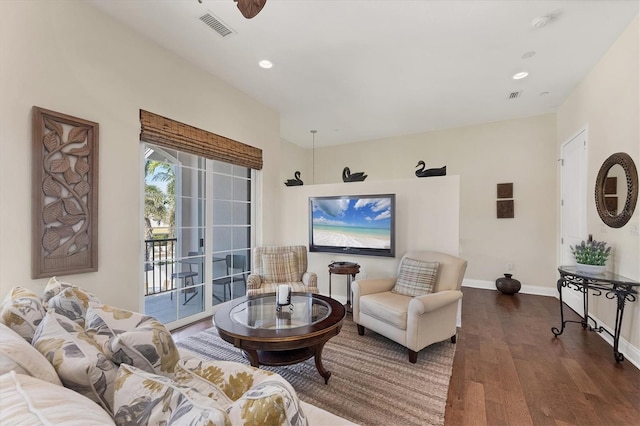 living area with visible vents, recessed lighting, baseboards, and wood finished floors