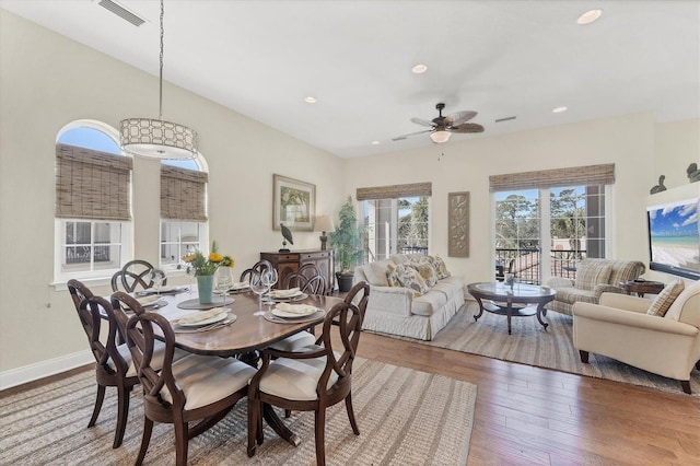 dining area with hardwood / wood-style flooring, recessed lighting, visible vents, and baseboards