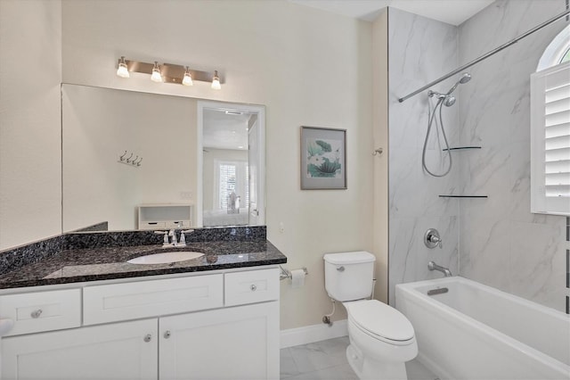 full bathroom featuring tub / shower combination, baseboards, toilet, marble finish floor, and vanity