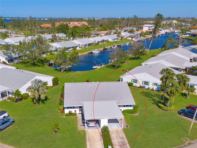 birds eye view of property featuring a residential view and a water view