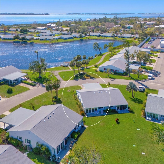 aerial view with a water view and a residential view