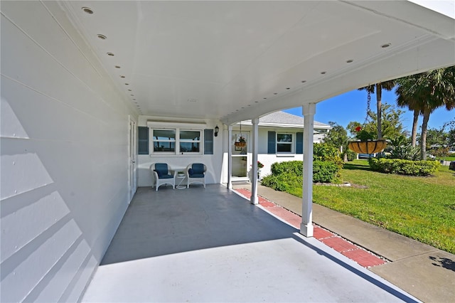 view of patio featuring an attached carport