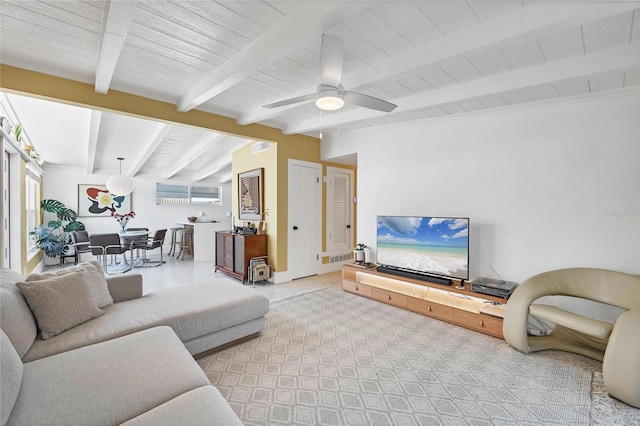 carpeted living area featuring a wealth of natural light, beamed ceiling, ceiling fan, and visible vents