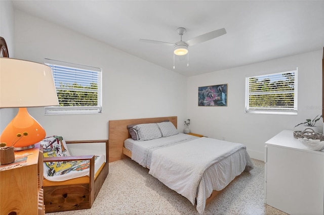 bedroom featuring light speckled floor and ceiling fan