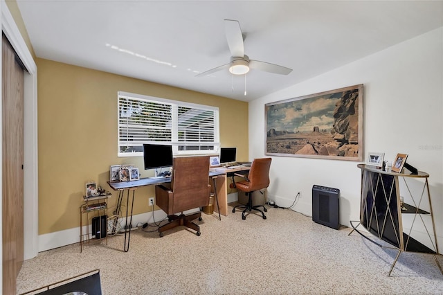 home office featuring baseboards, speckled floor, and ceiling fan