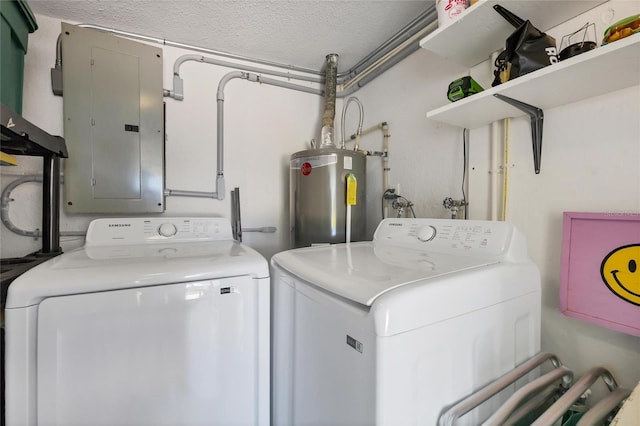 laundry room with water heater, laundry area, washer and dryer, and electric panel