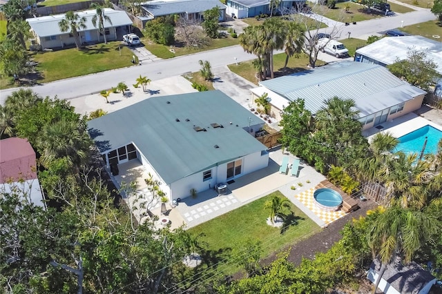 birds eye view of property with a residential view