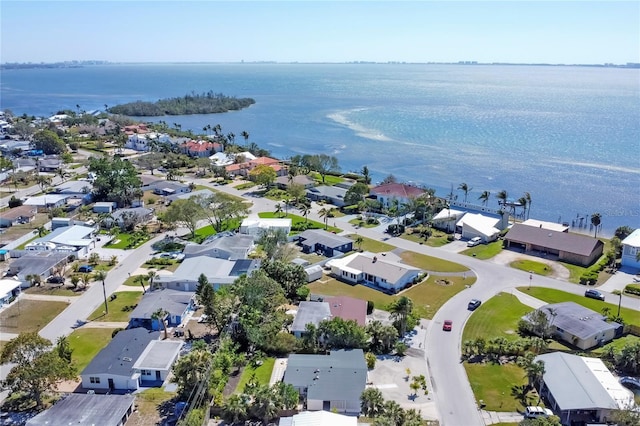 drone / aerial view with a residential view and a water view