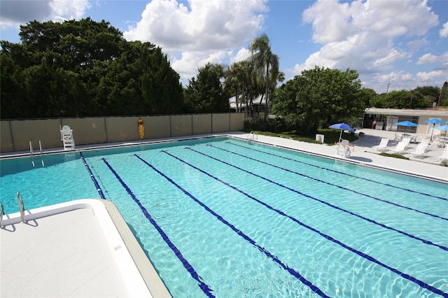 pool featuring a patio and fence