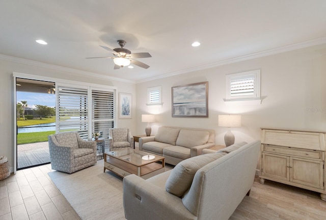 living room featuring recessed lighting, light wood-type flooring, a ceiling fan, and ornamental molding