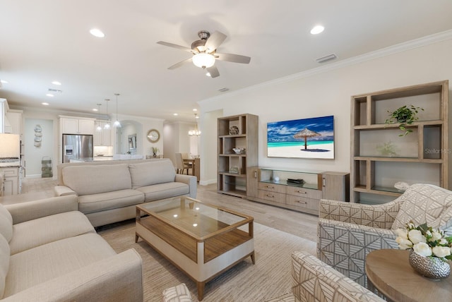 living room featuring light wood-type flooring, recessed lighting, visible vents, and ornamental molding