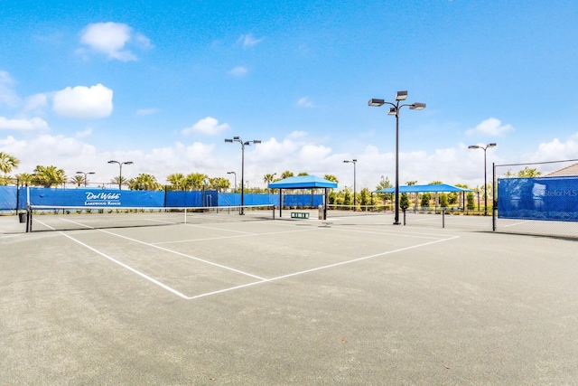 view of sport court featuring fence