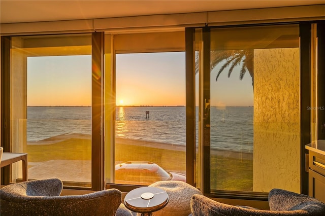 doorway to outside with a water view