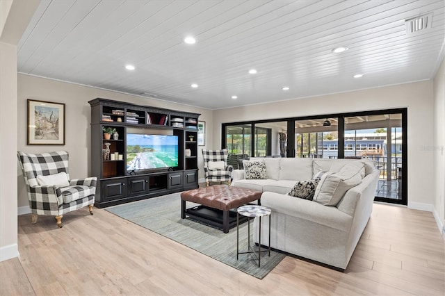 living room with wood ceiling, plenty of natural light, light wood-style floors, and recessed lighting