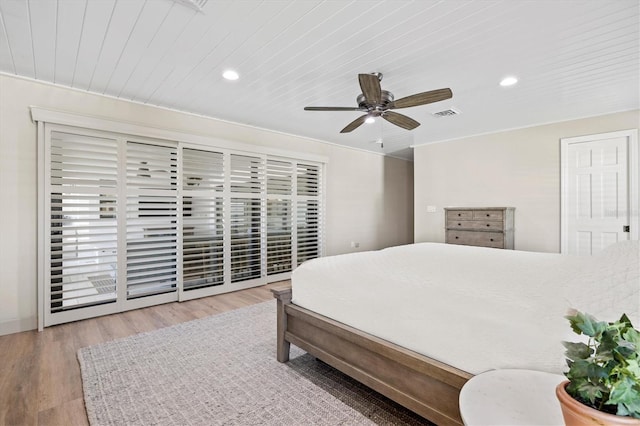 bedroom featuring wood finished floors, visible vents, recessed lighting, wooden ceiling, and access to outside