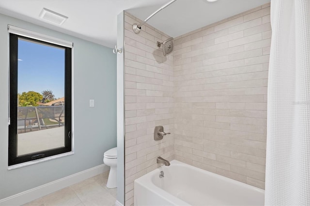 full bath featuring visible vents, baseboards, shower / bath combo, tile patterned flooring, and toilet