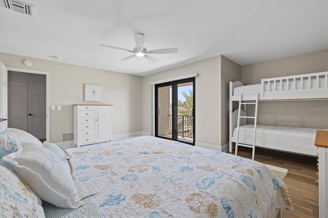 bedroom with visible vents, ceiling fan, baseboards, wood finished floors, and access to outside