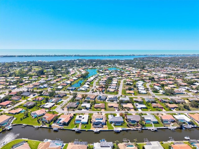 aerial view featuring a water view and a residential view