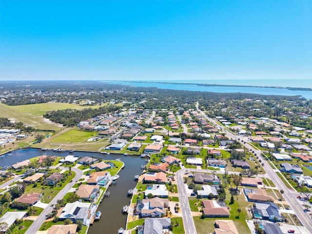 bird's eye view with a residential view and a water view