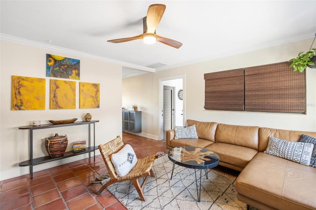 living room featuring tile patterned floors, baseboards, ceiling fan, and crown molding