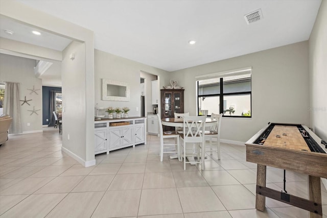 dining room with light tile patterned floors, visible vents, baseboards, and recessed lighting