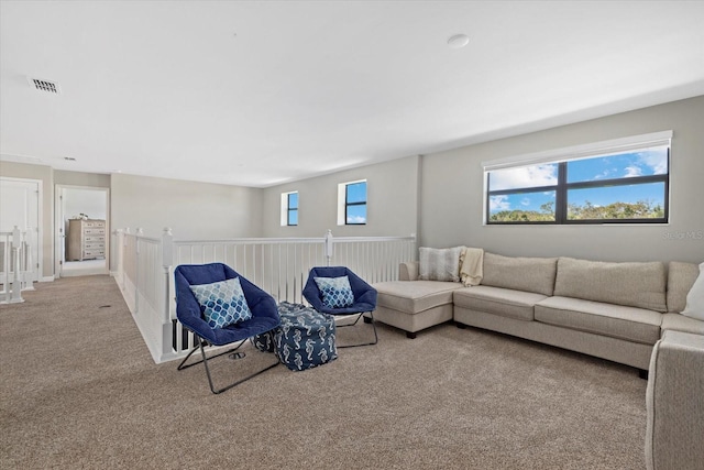 carpeted living room featuring visible vents