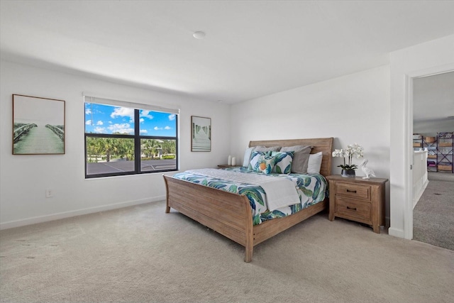 bedroom with baseboards and carpet floors