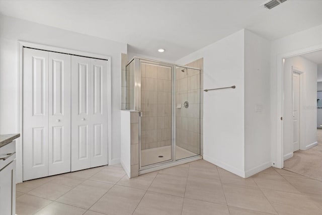 full bathroom with tile patterned floors, visible vents, and a stall shower