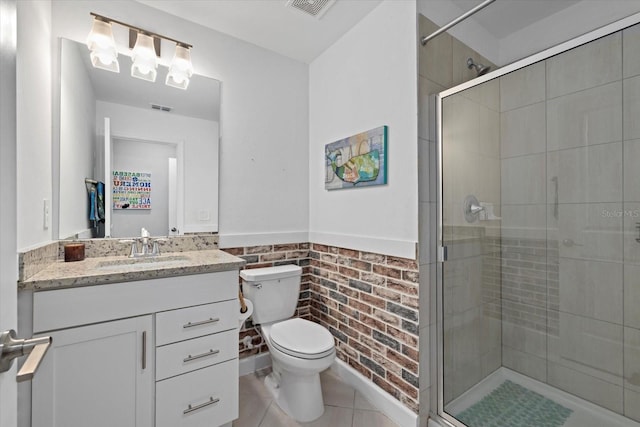 bathroom featuring visible vents, a stall shower, and toilet