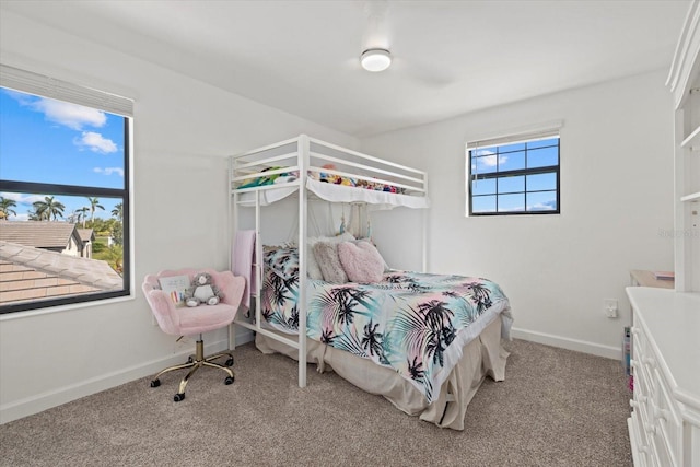 carpeted bedroom with baseboards