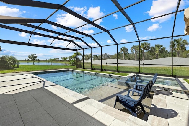 pool featuring glass enclosure, a patio, and a water view