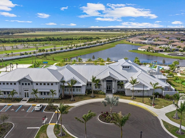 birds eye view of property with a water view and a residential view