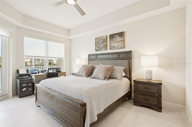 bedroom with ceiling fan and baseboards