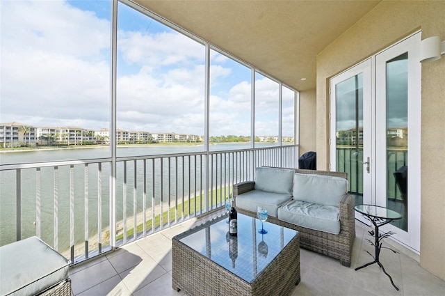 sunroom with a water view