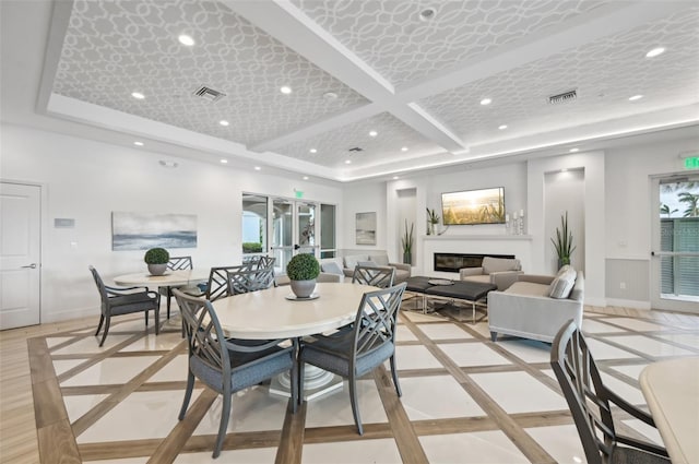 dining space featuring visible vents, recessed lighting, baseboards, and a glass covered fireplace