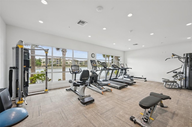 workout area with recessed lighting, carpet, visible vents, and baseboards