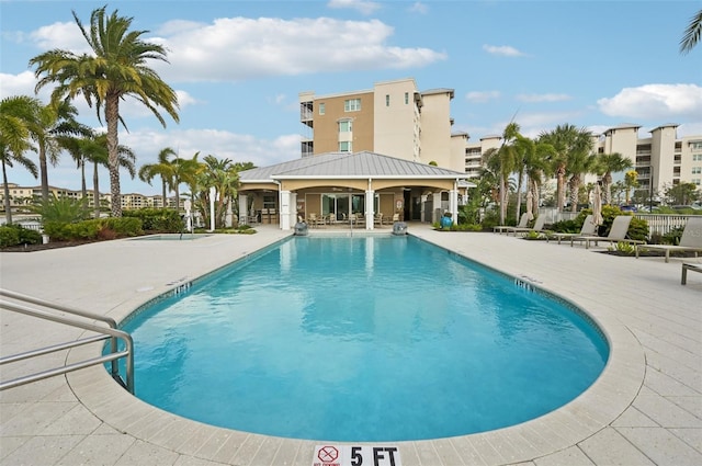 community pool with a patio