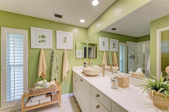 full bath featuring vanity, visible vents, marble finish floor, and a stall shower